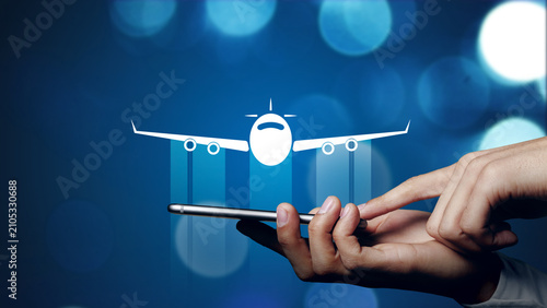 Принти на полотні Finding travel options using a smartphone to book flights easily online while pl