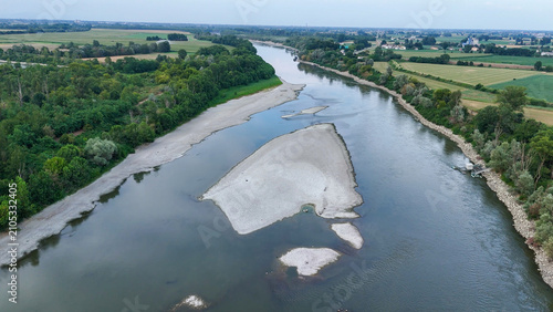 Po River experiencing low water levels. Revealing large sandbanks due to prolonged drought and environmental impact of a severe heatwave in 2026