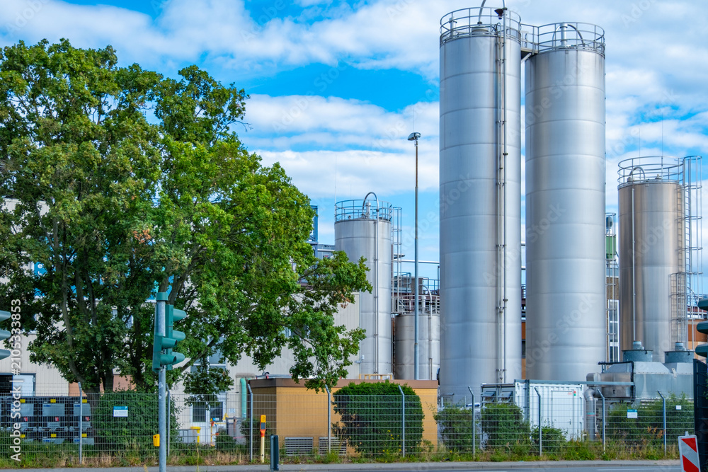 Fototapeta premium chemical storage tank, Industrial Chemiekonzern, plant, manufacturing and innovation, European industrial facility, Energy and Production, various tanks silo, Environmental Integration