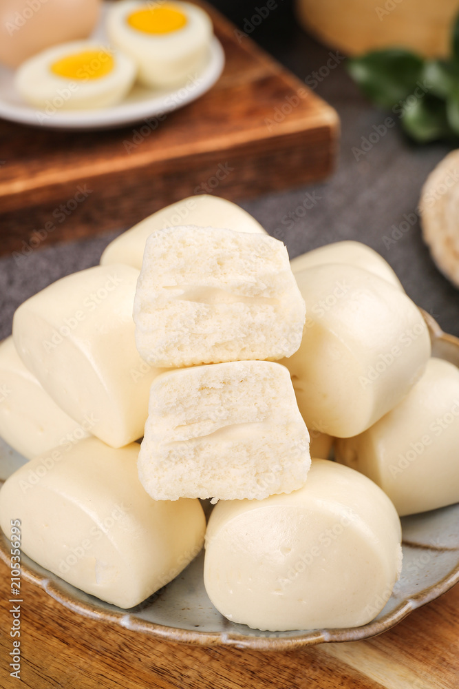 Fototapeta premium Creamy White Steamed Buns for Breakfast