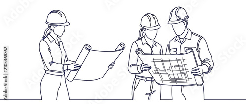 Construction workers discussing building plans on blueprints