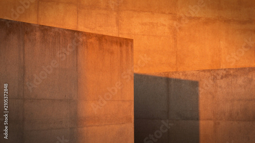  raw concrete walls bathed in a vivid orange light 