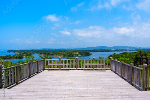 Bild auf Leinwand Spacious wooden deck terrace and benches at Kirigaki Observatory in Tomoyama Park