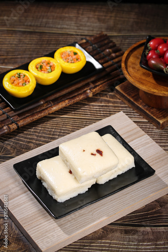 Fotografie Handmade White Sugar Cake with Red Garnish and Stuffed Peppers Breakfast Table S