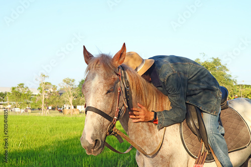 Gentle horse-human connection-trust and calm beneath the sky