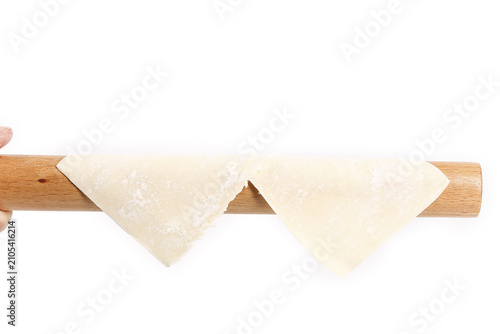 Ultra Thin Handmade Wonton Skins on Rolling Pin - Traditional Chinese Dumpling Wrapper Preparation
