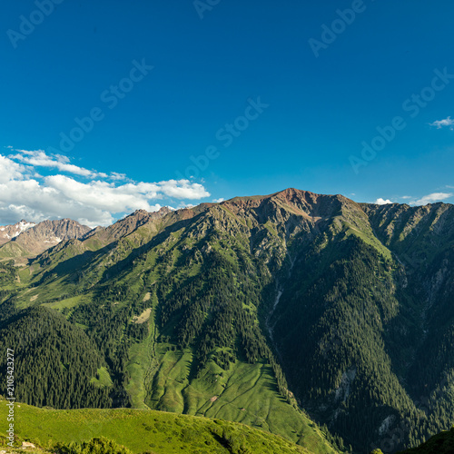 mountain landscape with blue sky and clouds