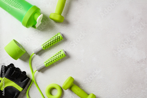 Fotografie Green gym gear and shaker bottle with copy space right