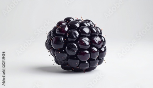 Close-up of a Ripe and Juicy Blackberry on White Background.