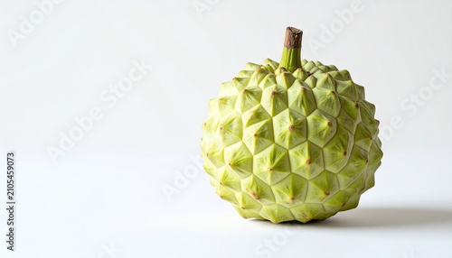 Close-up of a Green Sugar Apple on a White Surface.