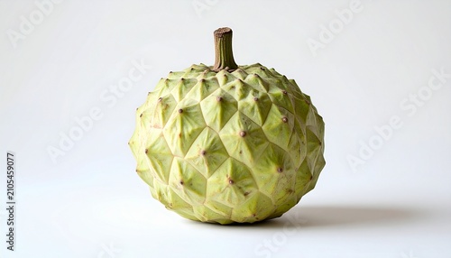 Close-up of a ripe custard apple against a white background.