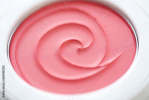 Pink swirled whipped cream in a bowl