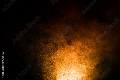 glitter brown dust sand isolated black background. texture wind smoke powder in the desert