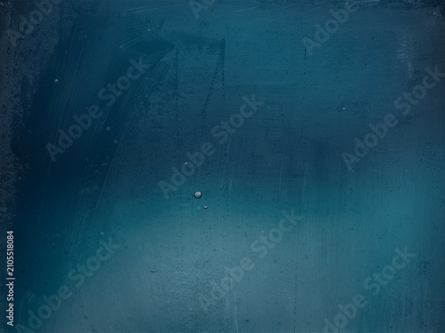Abstract blue textured background with subtle gradients and distressed surface details. Minimal artistic backdrop ideal for modern design, branding.