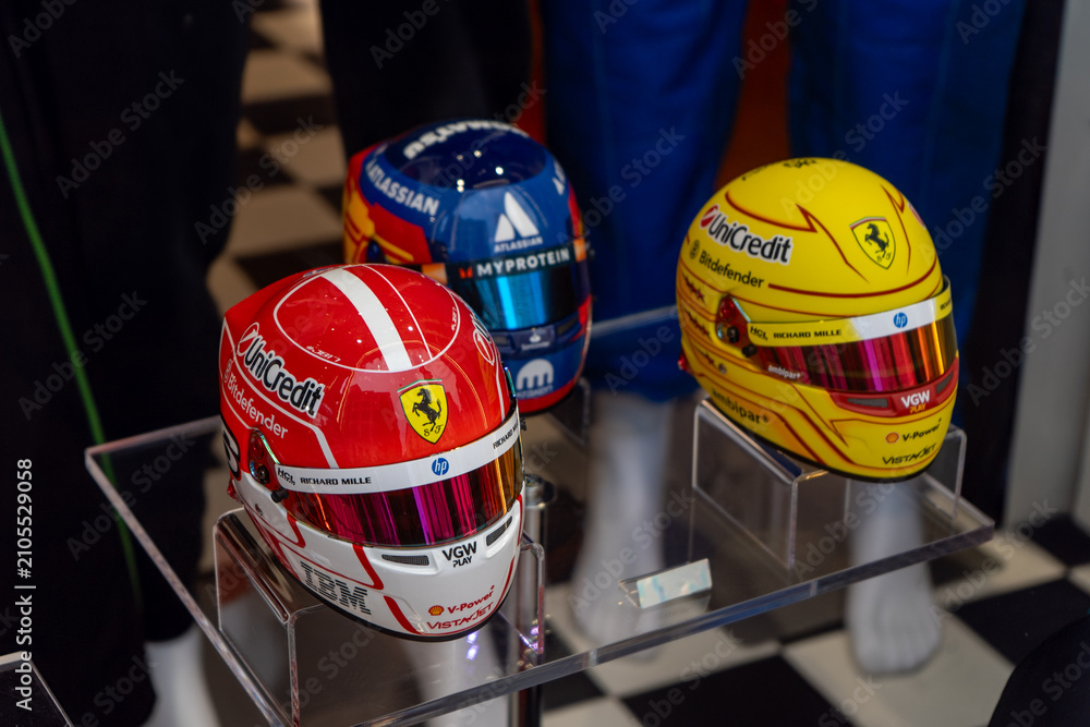 Obraz premium Formula 1 Racing Helmets with Ferrari and Williams Sponsor Logos. Team Shirt. Verona, Italy - June 25, 2026