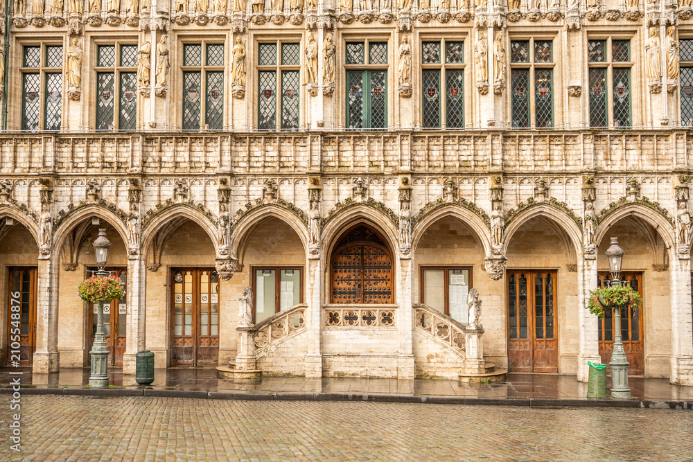 Fototapeta premium Symmetrical view of an ornate historic facade featuring Gothic arches and architectural details.