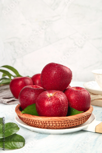 Bild auf Leinwand Fresh Red Fuji Apples in Wicker Basket from Shaanxi Plateau China - Healthy Orga