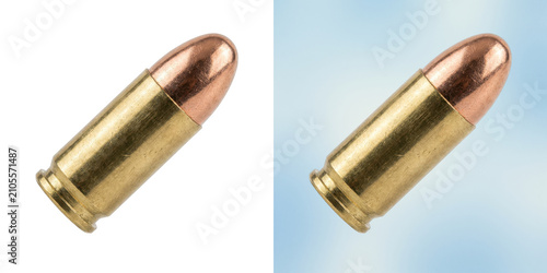 Fotografie Close-up of a single shiny copper bullet on a brass casing for weapons and ammun