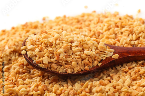 Crushed Peanuts in Wooden Spoon - Chopped Nuts for Baking and Cooking