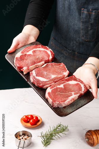 Konstfotografi Fresh Raw Beef Steaks on Cutting Board - Chef Presenting Premium Meat for Cookin