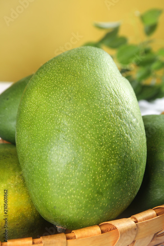 Konstfotografi Fresh Green Kate Mango from Panzhihua Sichuan China in Bamboo Basket with Water
