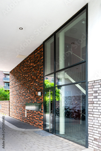 Front door of a modern apartment building in summer