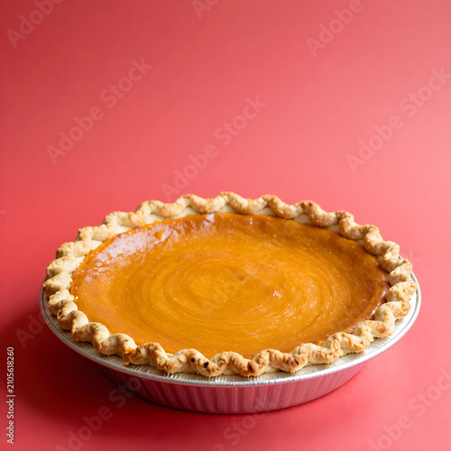 Whole pumpkin pie with a cr...