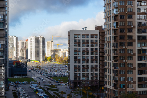 Konstfotografi Modern residential skyscrapers and busy city streets in Kyiv, Ukraine, under dramatic storm clouds