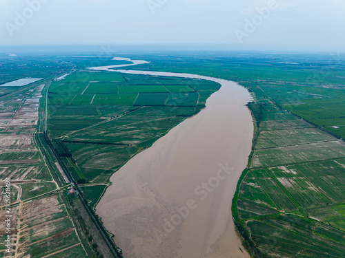 Canvas Print Aerial View of the Yellow River Winding Through Farmland in Dongying, China