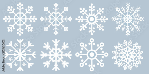 Photos White Snowflake Designs Set Against A Light Blue Background Winter Pattern Illus