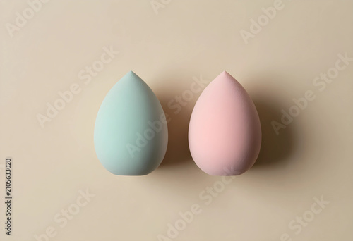 Two pastel colored cosmetic...