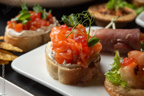 Konstfotografi Salmon canape with cream cheese on bread slice.