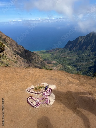 Traditional offering lei necklace on the ridge above a tropical valley on the Na Pali Coast of Kauai