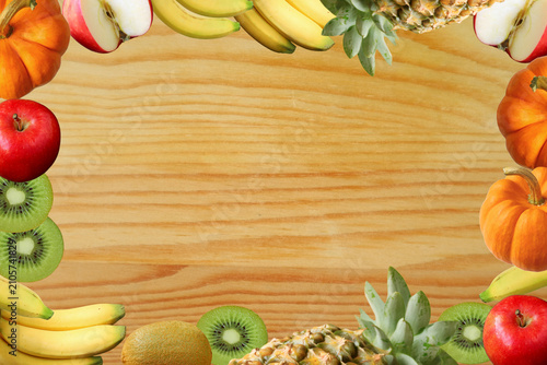 Frame of Colorful Assorted Fresh Ripe Fruits on Natural Wooden Background