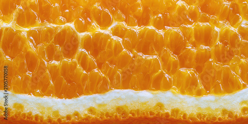 Close-up view of golden honeycomb with hexagonal cells
