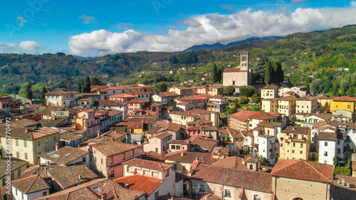 Obraz na plátně Beautiful aerial view of Barga, nestled in the Garfagnana valley, bathed in sunl