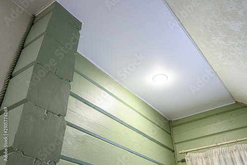 Canvastavla corner showcases pale green wooden wall panels, textured pillar with visible sea