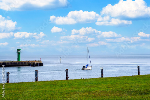 A sailing ship leaving the harbor of Büsum for the North Sea. 
