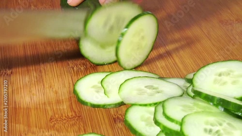Cutting Cucumber slices panorama with dill on white background isolated