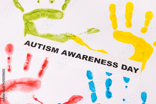Kids handprint made of paint and inscription Autism Awareness Day. Autism Spectrum Disorder