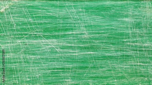 Painted surface showing heavy scratches on green background
