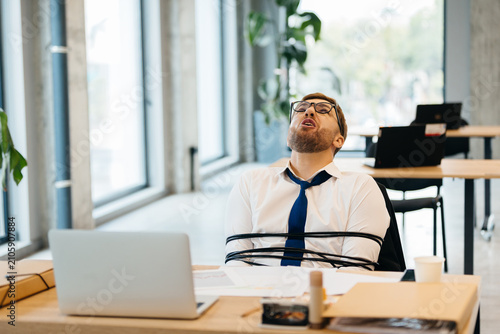 Cuadro en lienzo Stressed businessman trapped, feeling overwhelmed by office pressure