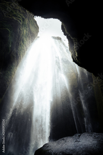 vertical photography of Gljufrabui waterfall hidden in a canyon near Seljalandsfoss on a March day