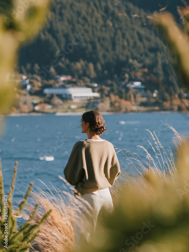 Traveller overlooking Lake in Queenstown, New Zealand