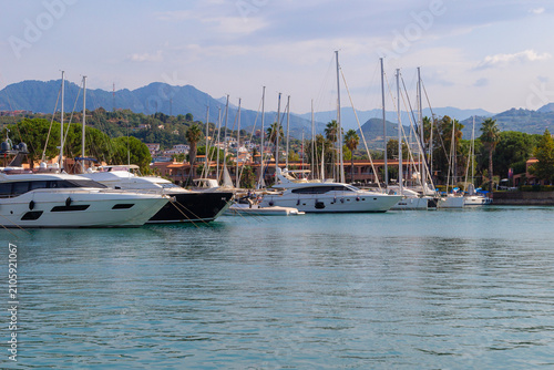 Bild auf Leinwand Luxury yachts and sailing boats moored at Portorosa Marina in Tonnarella, Sicily, Italy