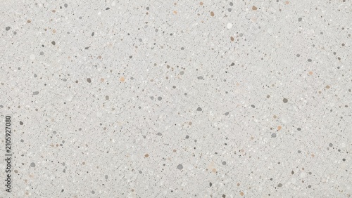 A high resolution close up of a light grey speckled terrazzo stone surface