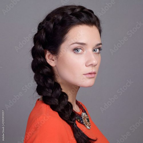 Beauty portrait of young beautiful brunette woman with bare shoulders