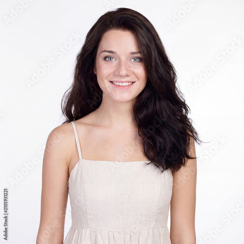 Beauty portrait of young beautiful brunette woman with bare shoulders