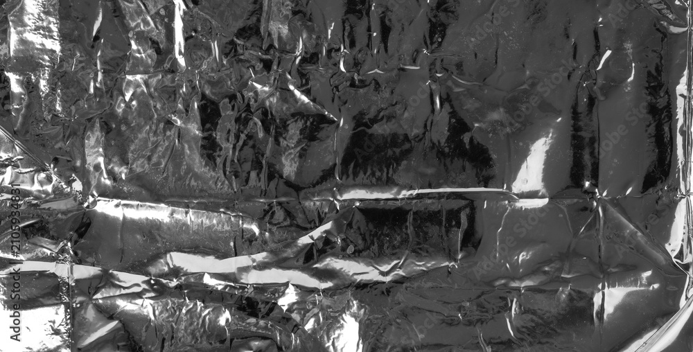 Obraz premium Silver foil textured background, crumpled aluminum pattern