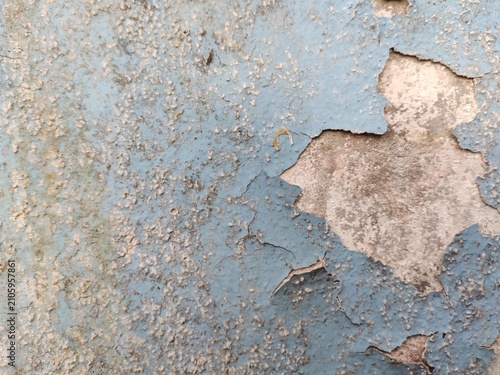 A distressed wooden surface featuring random peeling paint, chipped layers, cracks, scratches, and naturally weathered wood grain. The irregular worn texture creates a rustic, vintage, and aged appear
